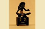 UTHPR012  Календарь `Абориген с мотыгой, сидящий`.